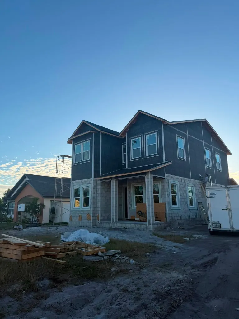 House wrapped and dried in with windows and roofing installed