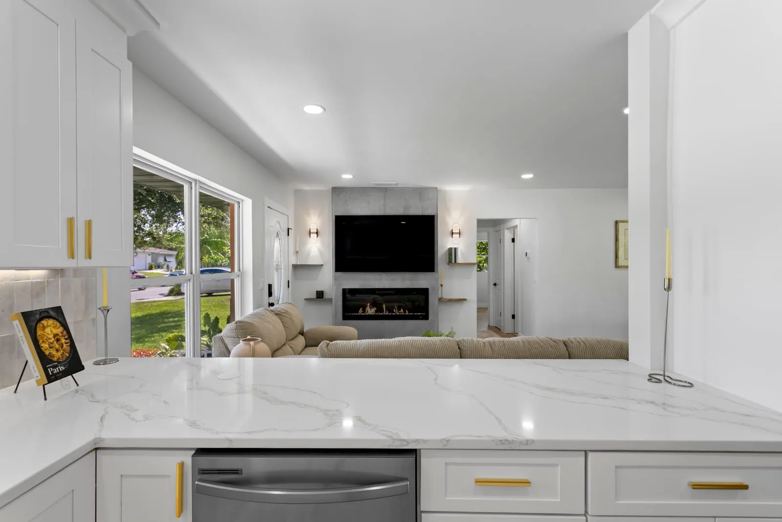 Open-plan living room with fireplace after a whole-home renovation