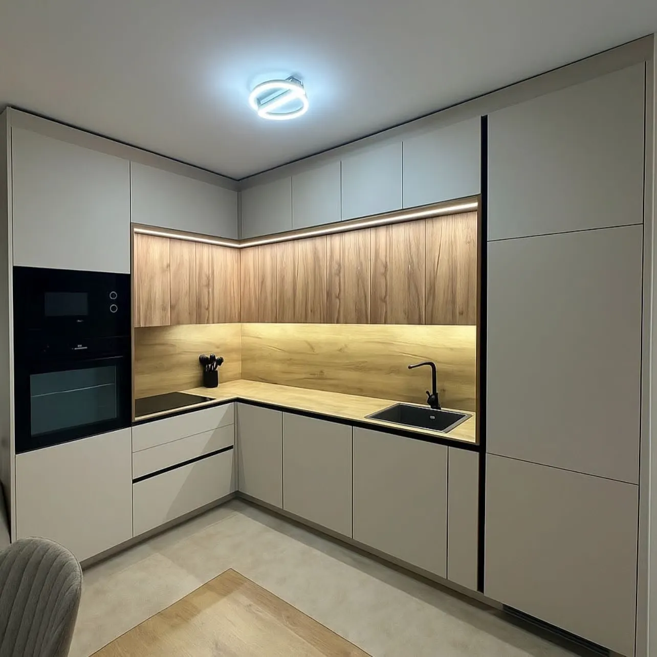 Completed kitchen cabinetry run with integrated appliances
