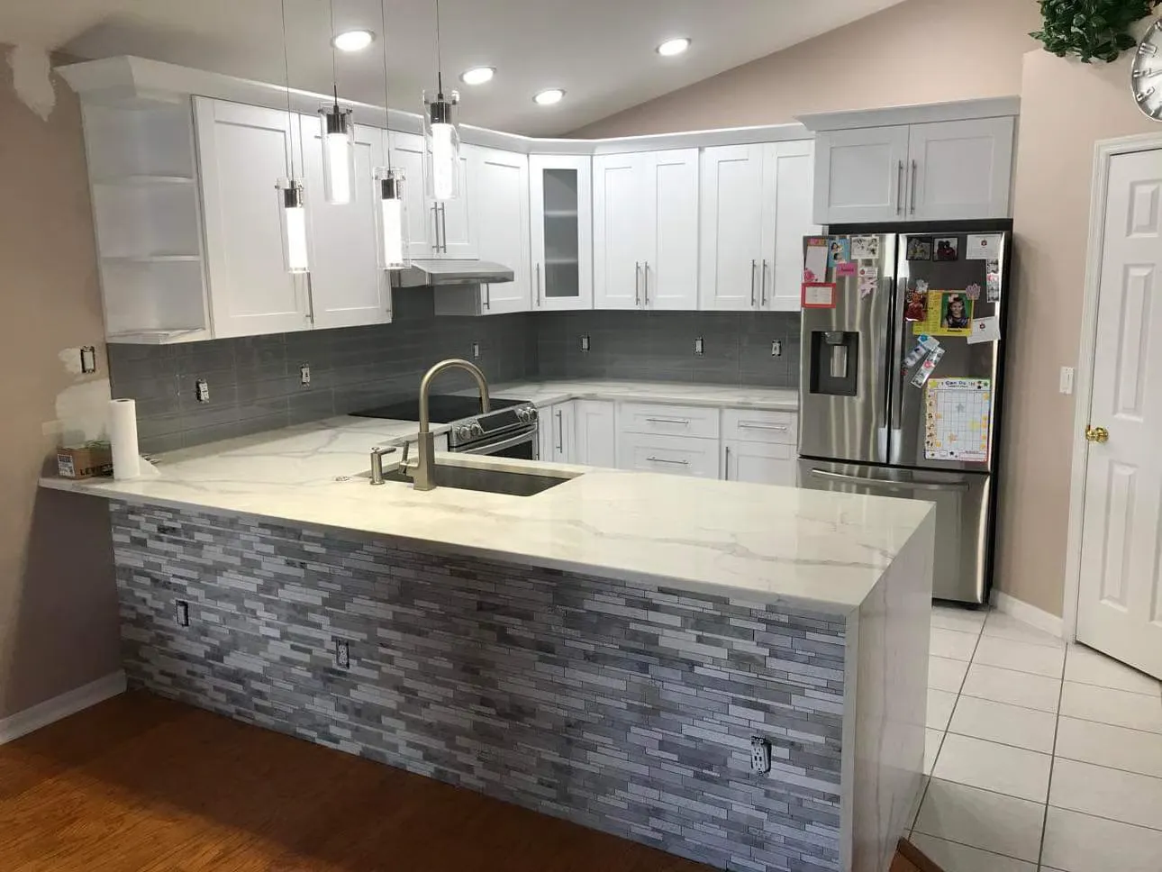 Kitchen island with seating and pendant lighting