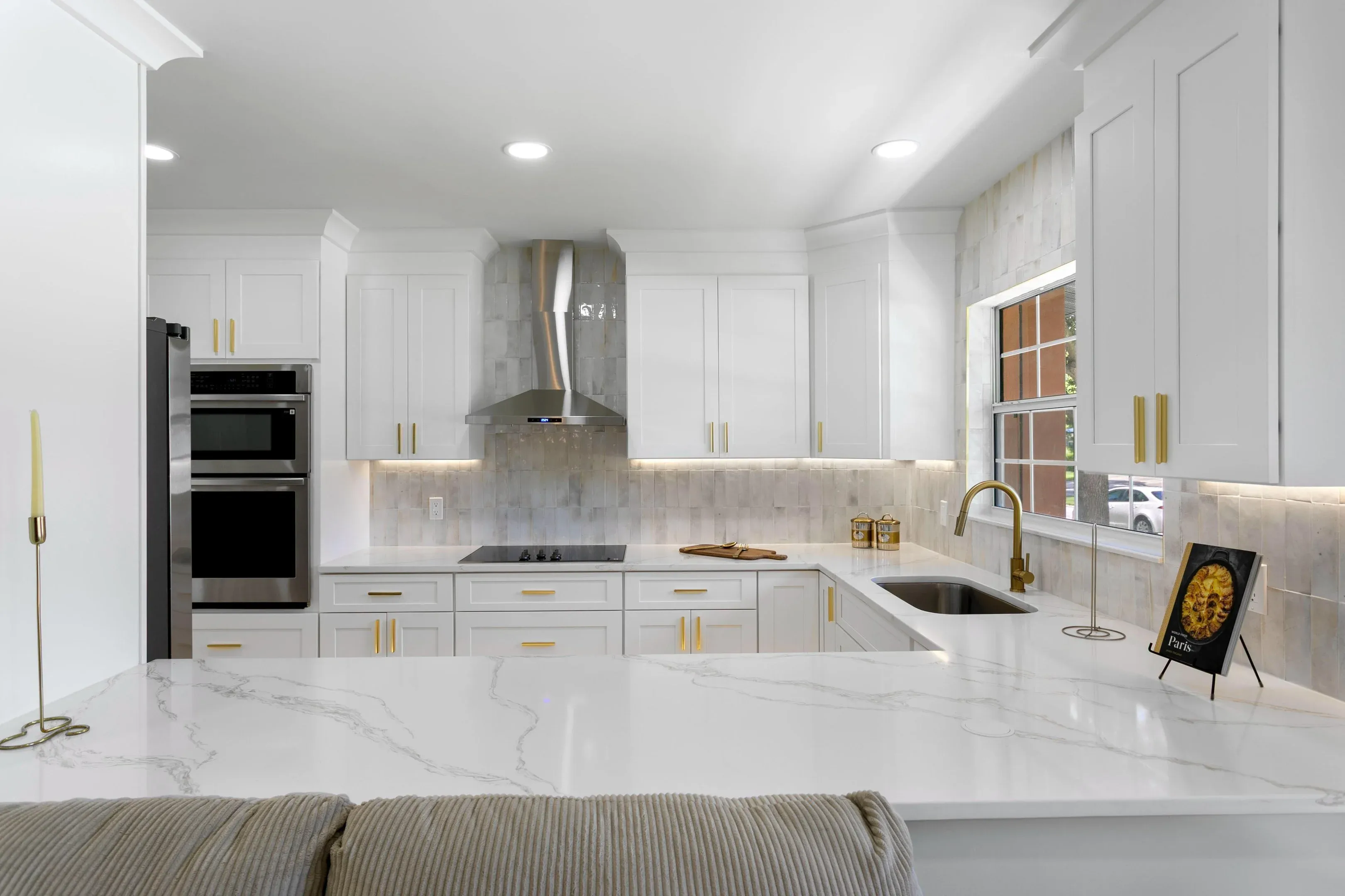 Finished kitchen in Tampa with white cabinetry and quartz counters