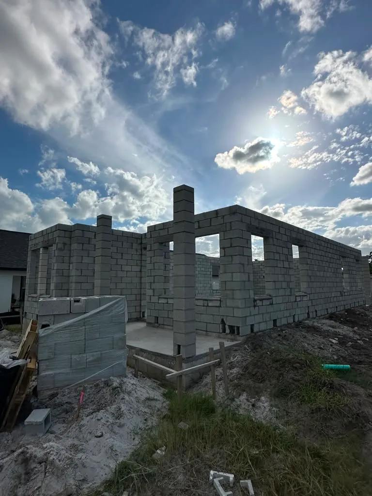 Concrete block exterior walls standing on the finished slab